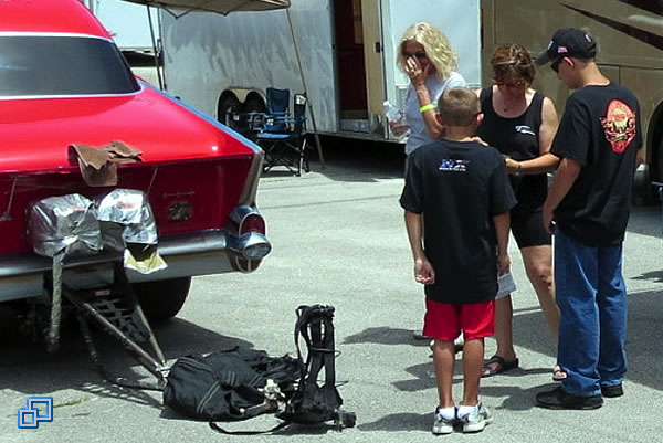 While packing the parachutes, I take a break to sign some autographs.