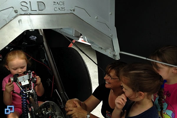 Three young ladies getting a closer look.