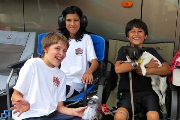 My two grandsons and their friend, enjoying the races and having a great time.